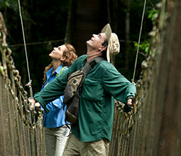 Tourists crossing a suspension bridge in the jungle of Loreto
